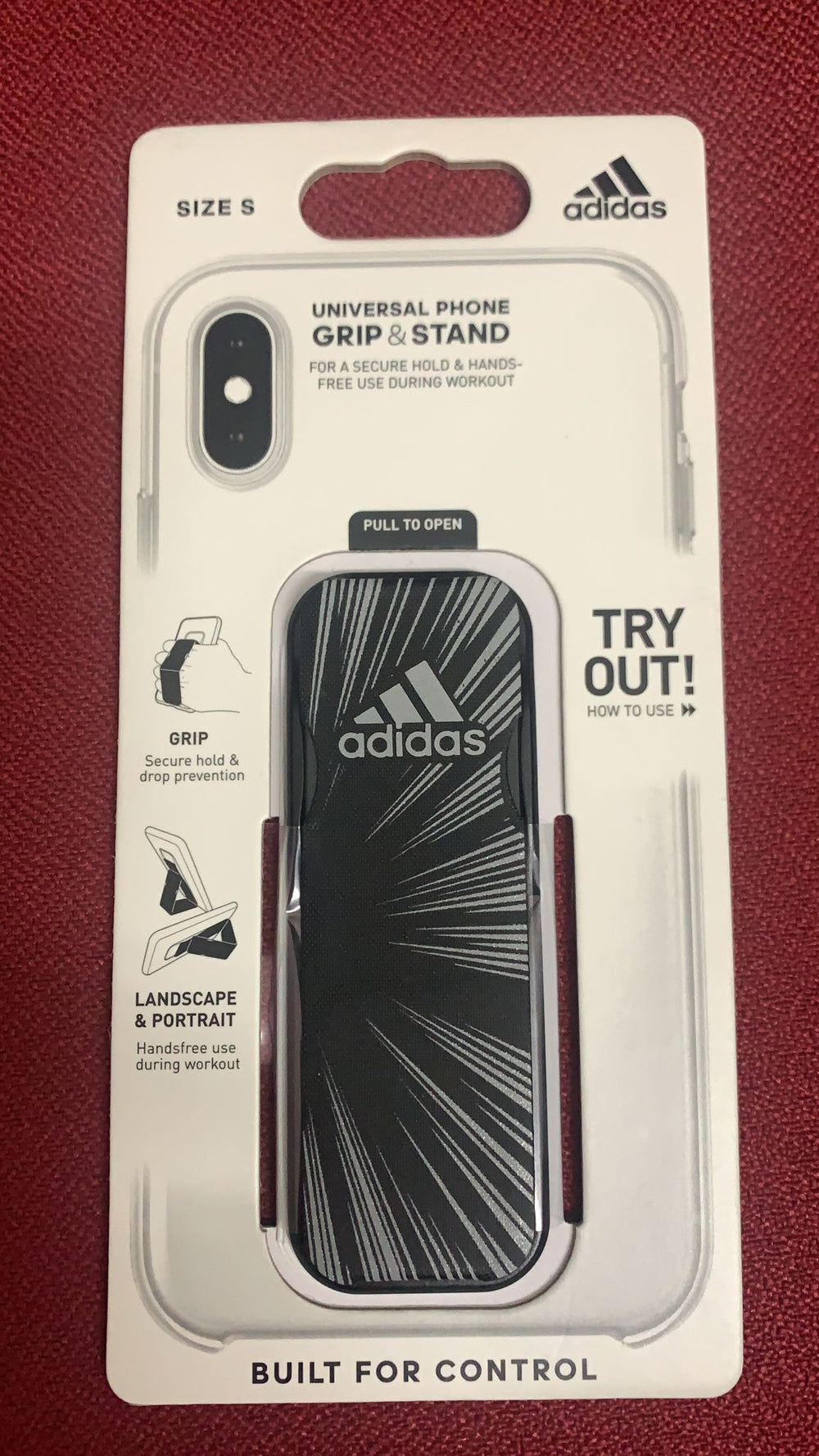 Adidas Grip Band – Soporte universal para smartphone Negro con logo Adidas.